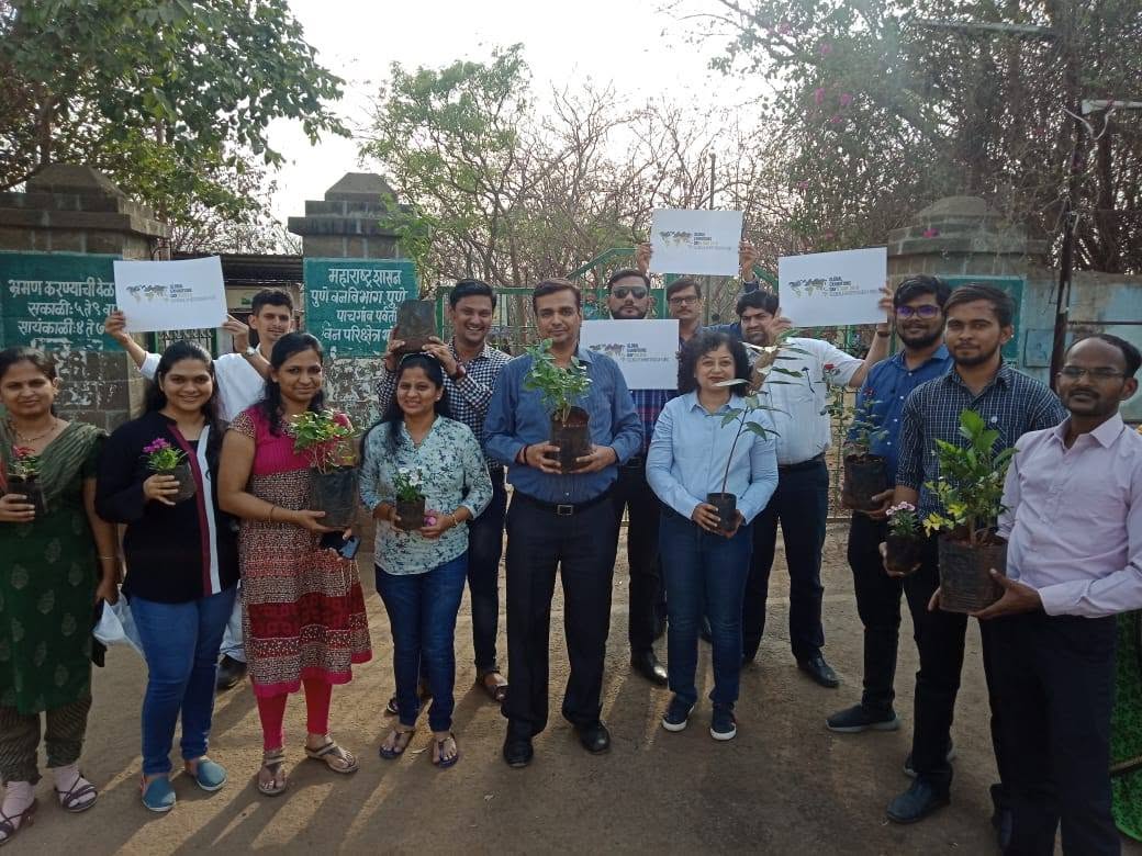 Coconnex team members planting trees as part of the company's giving activities